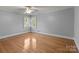 Sunlit bedroom featuring hardwood floors and fresh paint at 24501 Canton Rd, Albemarle, NC 28001