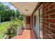 Charming front porch with brick detail and tiled floor welcomes you home at 24501 Canton Rd, Albemarle, NC 28001