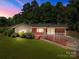 Charming brick home with stone accents, landscaped yard and a covered front porch perfect for relaxing at 24501 Canton Rd, Albemarle, NC 28001