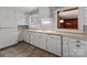 Functional kitchen with white cabinets, counters, and appliances at 24501 Canton Rd, Albemarle, NC 28001