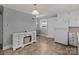 Bright kitchen and dining area with white appliances and a decorative dresser at 24501 Canton Rd, Albemarle, NC 28001