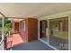 Outdoor porch space with brick flooring, a sliding glass door, and ample room at 24501 Canton Rd, Albemarle, NC 28001