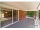 Spacious outdoor covered porch area with a sliding glass door leading to the interior at 24501 Canton Rd, Albemarle, NC 28001