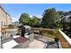 Relaxing back deck with outdoor seating, lush greenery, and privacy, perfect for entertaining guests at 2665 Grantham Place Dr, Fort Mill, SC 29715
