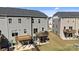 A backyard view showing wooden decks and patios, overlooking a grassy yard with fencing for privacy at 2665 Grantham Place Dr, Fort Mill, SC 29715