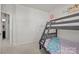 Charming bedroom featuring a bunk bed setup, adorned with vibrant decor and illuminated by natural light at 2665 Grantham Place Dr, Fort Mill, SC 29715