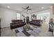 Living room featuring hardwood floors, modern seating, stylish decor, and an open layout leading into the kitchen at 2665 Grantham Place Dr, Fort Mill, SC 29715