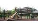 Community playground with slides and climbing structures set on a mulch surface at 2665 Grantham Place Dr, Fort Mill, SC 29715