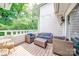 Cozy outdoor balcony seating area with wooded view, perfect for relaxing and entertaining at 2715 Selwyn Ave # 36, Charlotte, NC 28209