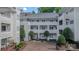 Exterior courtyard view of multi-story condo building with balconies and mature landscaping at 2715 Selwyn Ave # 36, Charlotte, NC 28209
