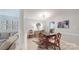 Elegant dining room featuring modern lighting, hardwood floors, and views of the living area at 2715 Selwyn Ave # 36, Charlotte, NC 28209