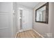 Bright entryway featuring wood-look floors, and a large mirror perfect for last-minute checks before heading out at 2715 Selwyn Ave # 36, Charlotte, NC 28209