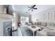 Living room featuring hardwood floors, fireplace, ceiling fan, and sliding glass doors at 2715 Selwyn Ave # 36, Charlotte, NC 28209