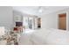 Bright main bedroom featuring neutral decor, ceiling fan, and sliding glass door to a patio at 2715 Selwyn Ave # 36, Charlotte, NC 28209