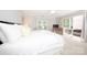 Bright main bedroom with natural light, balcony access, and calming neutral decor at 2715 Selwyn Ave # 36, Charlotte, NC 28209