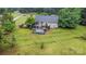 Aerial shot of a spacious backyard with an above-ground pool, deck, and lush green surroundings at 2906 Chapman Cir, Rock Hill, SC 29732