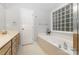Bright bathroom with double vanity sinks, cabinets, a garden tub and a walk-in shower at 2906 Chapman Cir, Rock Hill, SC 29732