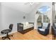 Bright bedroom featuring a large arched window, hardwood floors, and vaulted ceilings at 2906 Chapman Cir, Rock Hill, SC 29732