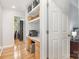Hallway with hardwood floors and a built-in desk and shelving space perfect for a home office at 2906 Chapman Cir, Rock Hill, SC 29732