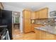 Well-equipped kitchen featuring a black refrigerator and wooden cabinets at 2906 Chapman Cir, Rock Hill, SC 29732
