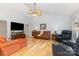 Comfortable living room with vaulted ceiling, hardwood floors, and multiple seating options at 2906 Chapman Cir, Rock Hill, SC 29732