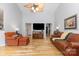 Bright living room with hardwood floors, vaulted ceiling with fan, and comfortable seating area at 2906 Chapman Cir, Rock Hill, SC 29732