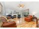 Open-concept living room with fireplace, hardwood floors, and seamless access to the dining area at 2906 Chapman Cir, Rock Hill, SC 29732