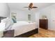 Bright bedroom with a ceiling fan, neutral walls, hardwood floors, and natural light at 2906 Chapman Cir, Rock Hill, SC 29732