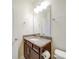 Bathroom features a single sink vanity with granite countertop and good lighting at 3022 Burnello Ct, Iron Station, NC 28080