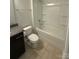 Well-lit bathroom featuring a tub-shower combo, granite countertop, and tile flooring at 3022 Burnello Ct, Iron Station, NC 28080