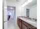 Bathroom featuring double sink vanity with granite counters and good lighting at 3022 Burnello Ct, Iron Station, NC 28080