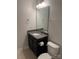 Bathroom featuring a dark wood vanity with granite counters and a white sink at 3022 Burnello Ct, Iron Station, NC 28080