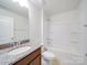 This bathroom has a granite countertop and shower with a tub at 3022 Burnello Ct, Iron Station, NC 28080
