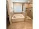 Bathroom featuring a tub, shower, and tile surround at 3022 Burnello Ct, Iron Station, NC 28080