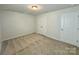 Comfortable bedroom with carpet flooring and a closet for storage convenience at 3022 Burnello Ct, Iron Station, NC 28080
