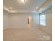 Bright bedroom with tray ceiling, neutral carpet, and double windows allowing for ample natural light at 3022 Burnello Ct, Iron Station, NC 28080