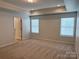 Bedroom features neutral walls, carpet, two windows with blinds, and a closet at 3022 Burnello Ct, Iron Station, NC 28080