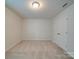 This bedroom has neutral walls, carpet and a double door closet at 3022 Burnello Ct, Iron Station, NC 28080