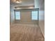 A bedroom with a trey ceiling, neutral walls, carpet, and two windows with blinds at 3022 Burnello Ct, Iron Station, NC 28080