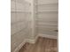 Well-organized walk-in closet with wire shelving and neutral colored walls at 3022 Burnello Ct, Iron Station, NC 28080