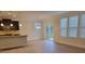 Bright living room with modern lighting, neutral walls and access to outdoor patio at 3022 Burnello Ct, Iron Station, NC 28080