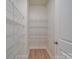Walk-in pantry equipped with metal shelving for organized storage and light-colored flooring at 3022 Burnello Ct, Iron Station, NC 28080