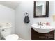 Small bathroom featuring a vanity, a mirror, a toilet, and modern fixtures at 3049 Stablegate Dr, Gastonia, NC 28052