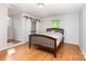 The bedroom features hardwood floors, natural light and a closet at 3049 Stablegate Dr, Gastonia, NC 28052