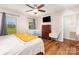 A bedroom features wood floors, natural light, and closet at 3049 Stablegate Dr, Gastonia, NC 28052