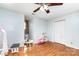A bedroom features wood floors, natural light, and a white closet door at 3049 Stablegate Dr, Gastonia, NC 28052