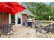Outdoor deck area offers a dining area, seating and a built-in BBQ grill at 3049 Stablegate Dr, Gastonia, NC 28052