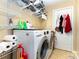 Laundry area offers modern washer and dryer and plenty of storage space with wire shelving at 3049 Stablegate Dr, Gastonia, NC 28052