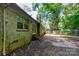 Backyard view highlighting brick exterior, steps, and surrounding greenery, perfect for outdoor enjoyment at 3316 Fairhaven Rd, Rock Hill, SC 29732