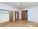 Spacious bedroom featuring multiple closets and doors, offering ample storage and access to other areas at 3316 Fairhaven Rd, Rock Hill, SC 29732